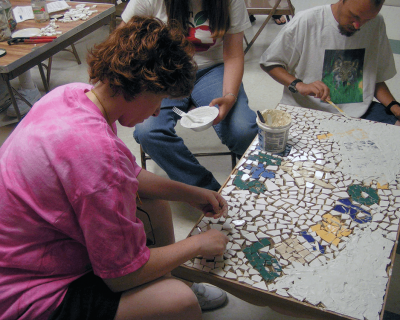 carrie working on a mosaic
